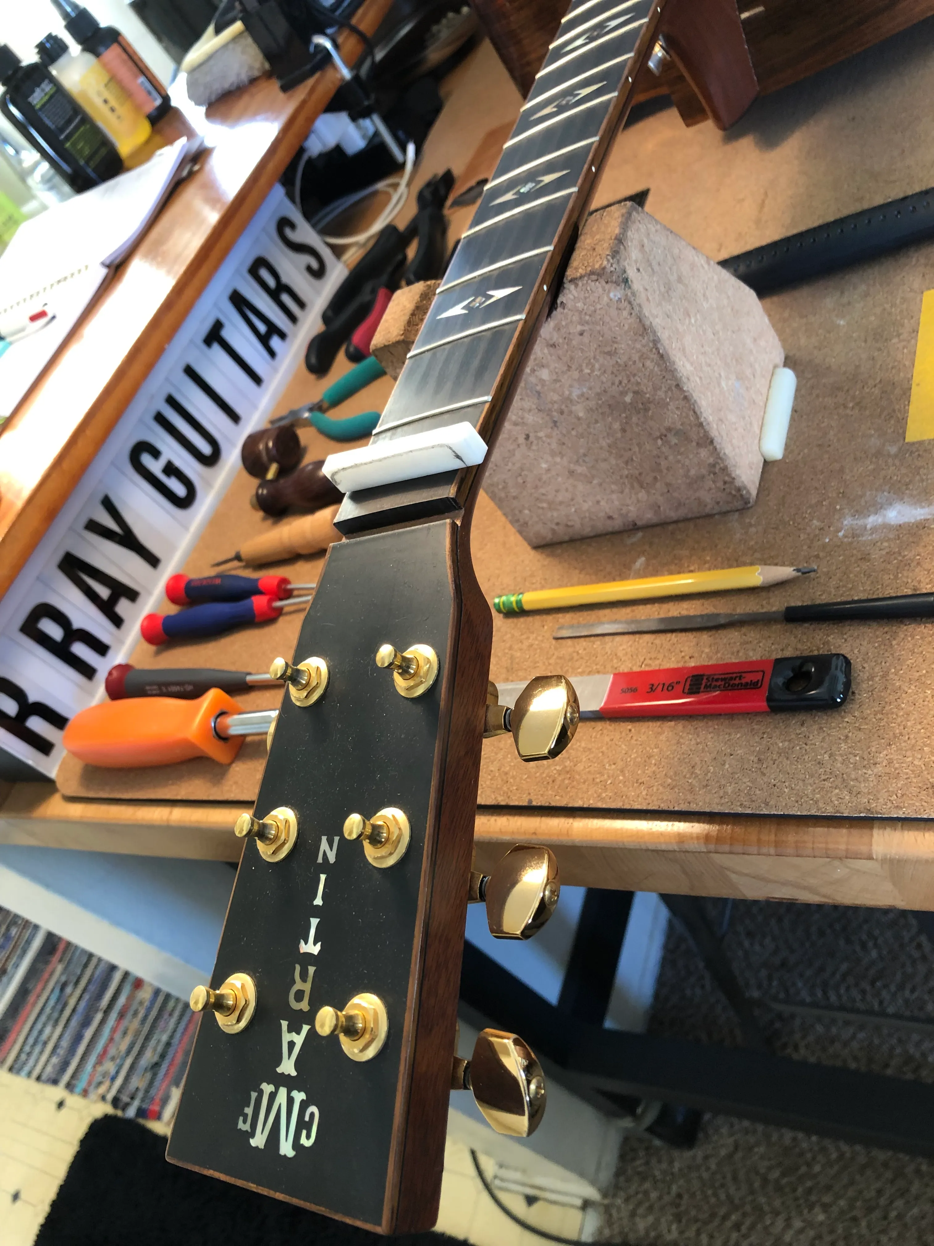 Gallery image 35 showing guitar repair work