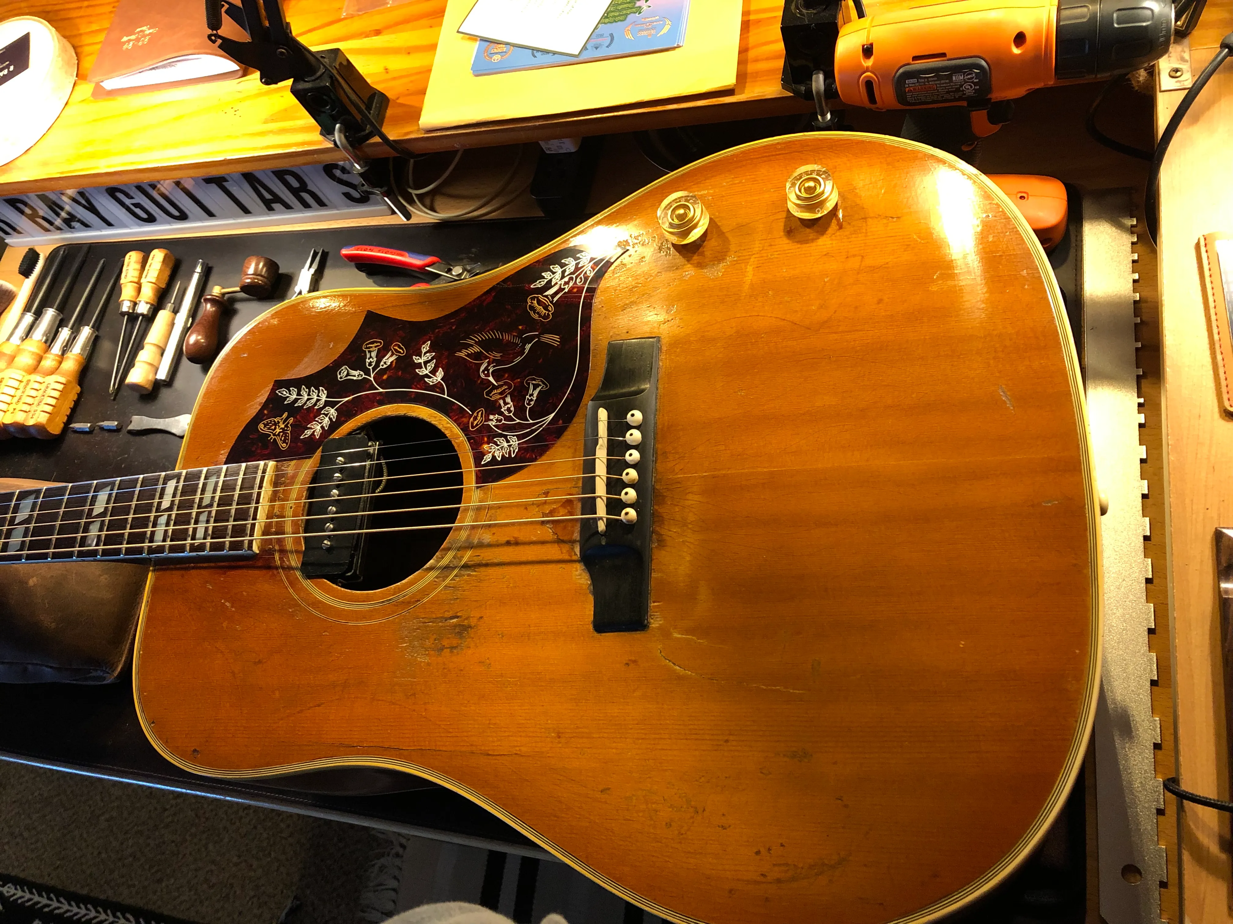 Acoustic-electric guitar on the R. Ray Guitars workbench in Newport Beach