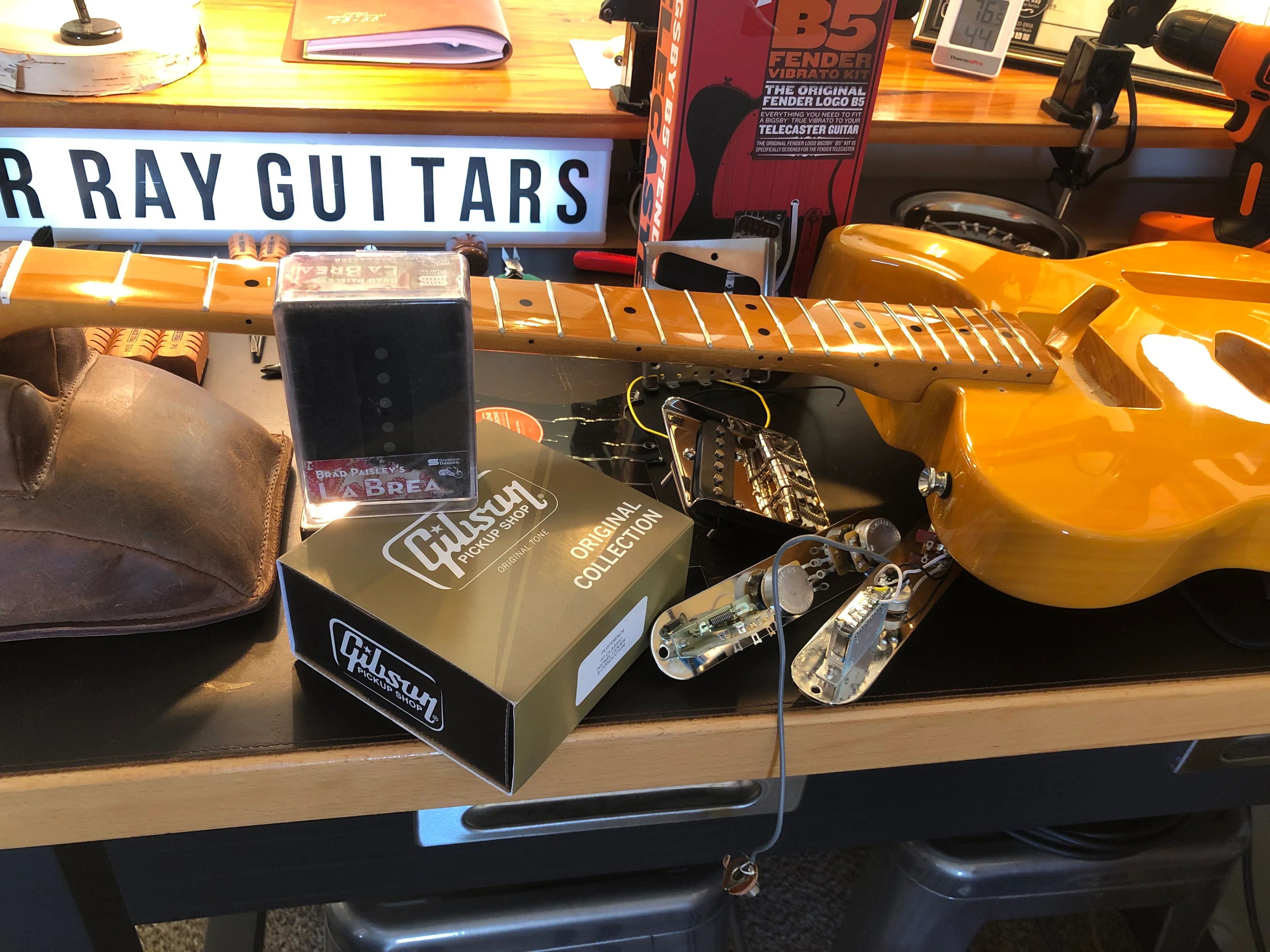 Guitar pickups and parts on the workbench